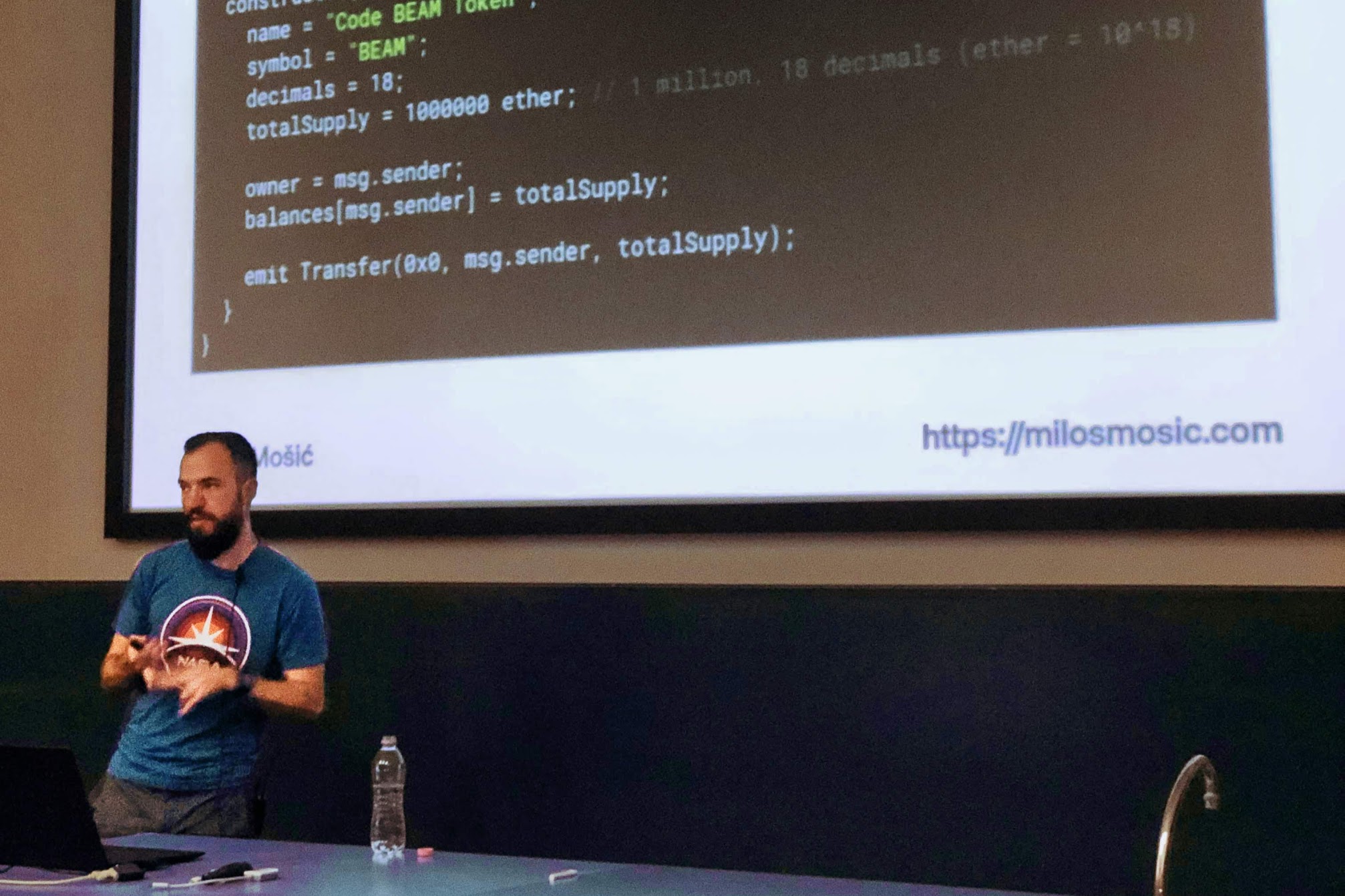 Miloš Mošić showing an example Smart Contract code