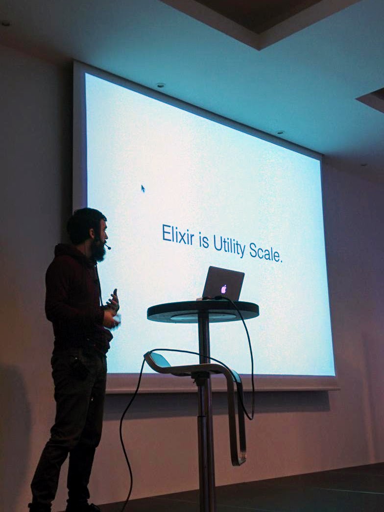 Miloš Mošić giving a talk about the switch to Elixir